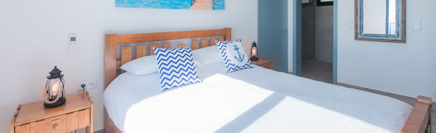 Blue-Sea-Villa-Master-Bedroom-with-Seaview-Balcony-Aircon